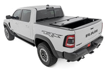 Load image into Gallery viewer, Hard Tri-Fold Flip Up Bed Cover | 6'4" | Ram 1500 (19-26)/1500 TRX (21-24) 